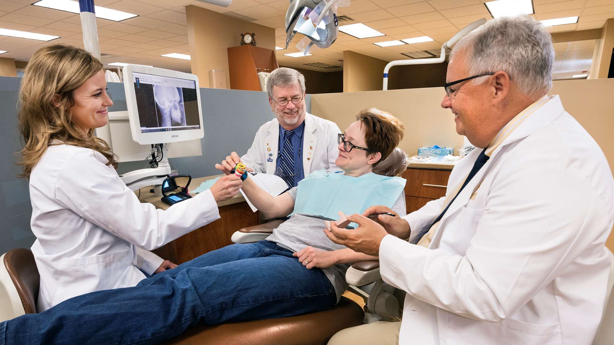 A patient receives a consultation in the orthodontics clinic.