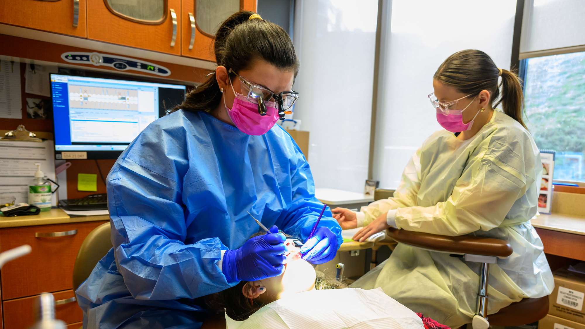 A WVU dental school student receives one-on-one instruction in a small class size.