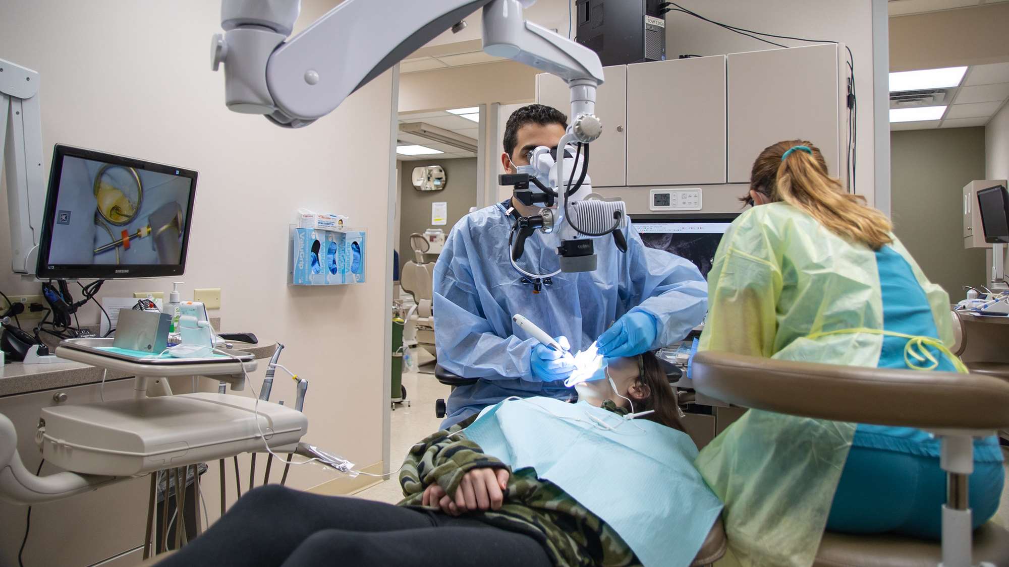 An endodontics resident's patient receives root canal treatment.